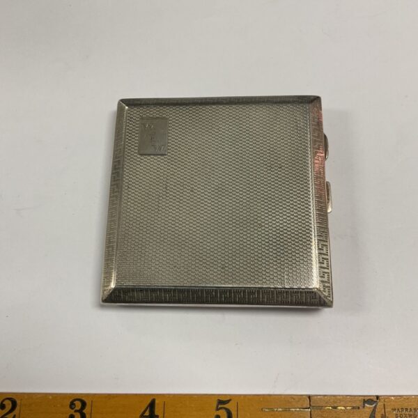 Art Deco sterling silver cigarette case with engine-turned lid and greek key border