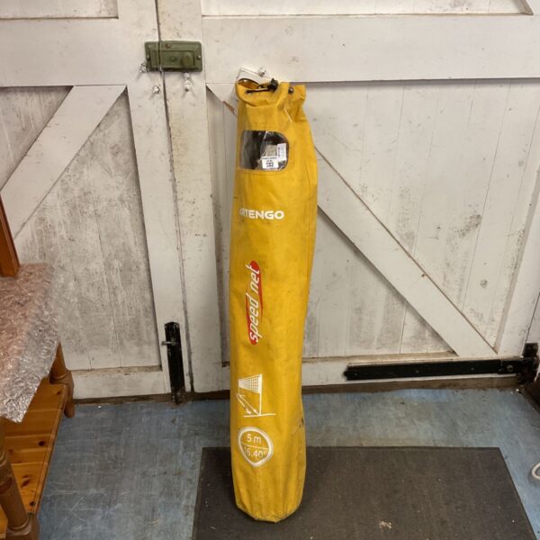 Yellow Artengo speednet badminton net in carry bag.
