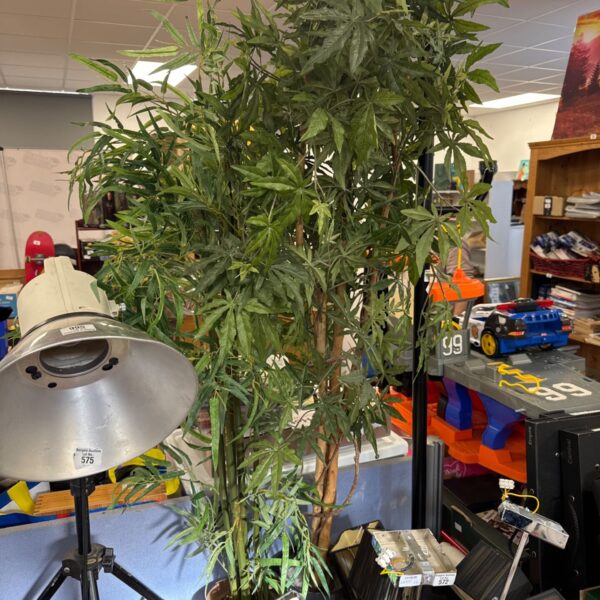 Artificial hemp and bamboo plants in pots for home decor.