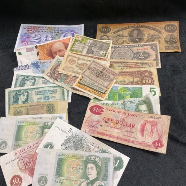 Assorted banknotes from around the world, a collectible currency lot.