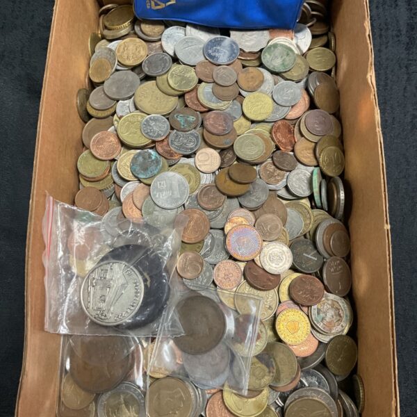 Large lot of assorted coins, including vintage and world currencies.