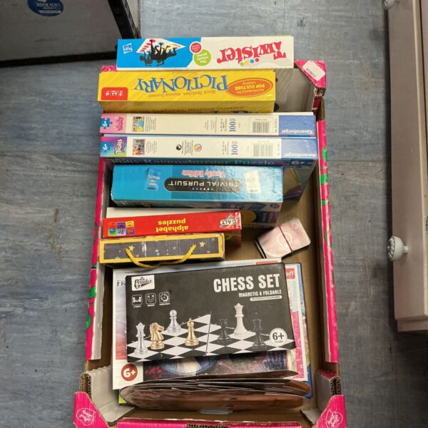Assorted games and puzzles lot including chess and trivial pursuit.