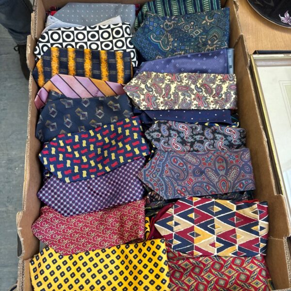 Tray of assorted gents neckties in paisley, geometric and striped patterns