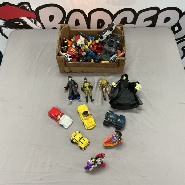Assorted toy lot featuring McDonald's, Harry Potter, and Batman figures.