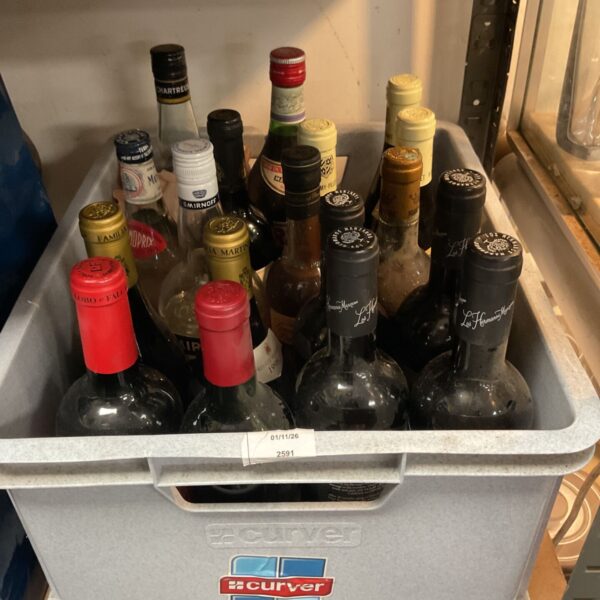 Assorted wine and spirit bottles including Smirnoff and Lobo e Falcao in grey crate