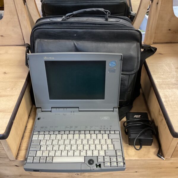 AST Bravo NB 4/33s laptop with black carry case and AST charger
