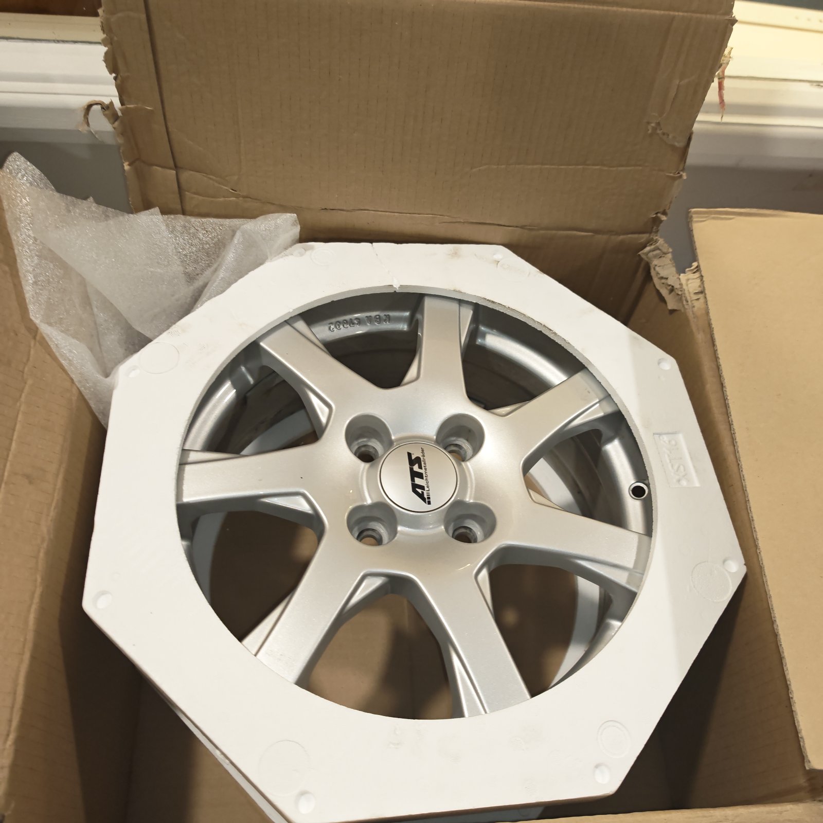 Silver ATS alloy wheel with centre cap in white protective packaging