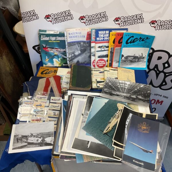 Vintage aviation ephemera collection including WWII magazines and posters.