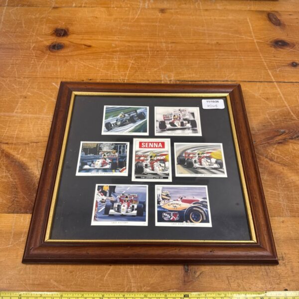 Framed Ayrton Senna collectors cards, a Formula 1 racing collectible.