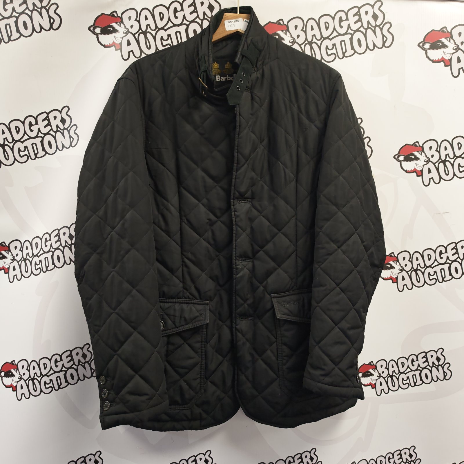 Dark Barbour quilted jacket in medium size with diamond stitching and stand collar