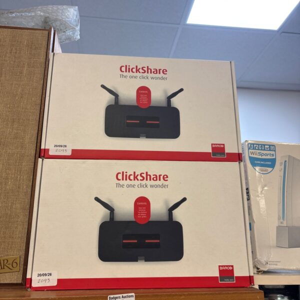 Two Barco ClickShare CSM-1 wireless presentation systems in original boxes.