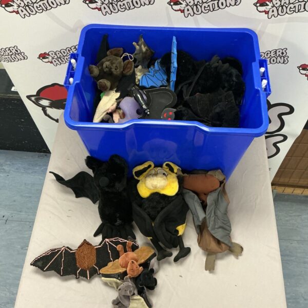 Box of assorted bat soft toys for Halloween or collecting.