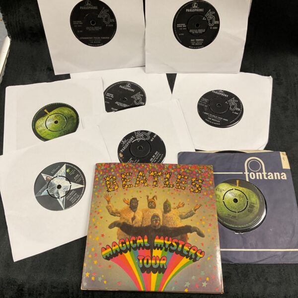 Lot of nine Beatles 7" records with Parlophone and Apple labels and paper sleeves