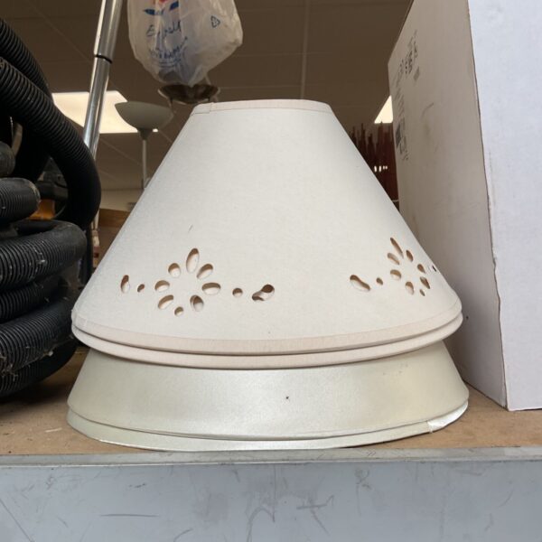 Cream conical bedroom lamp shades with pierced floral detail, stacked with pearlescent shade