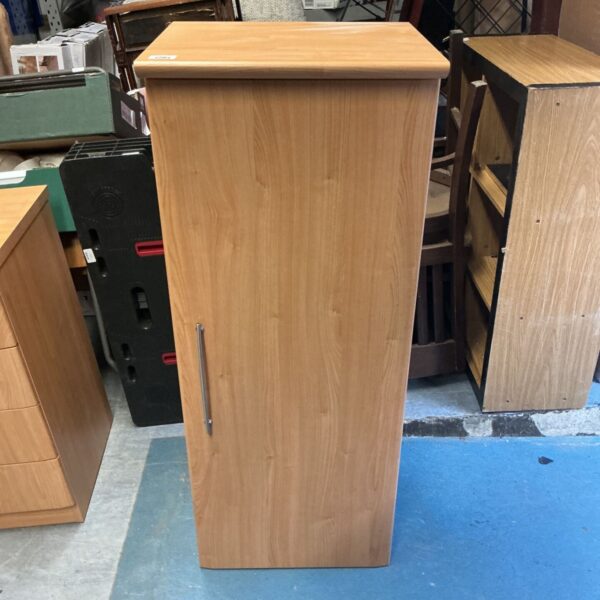 Beech effect wooden cupboard for home storage.
