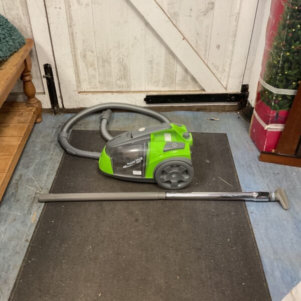Green Beldray Power Max cylinder vacuum cleaner on a rug.