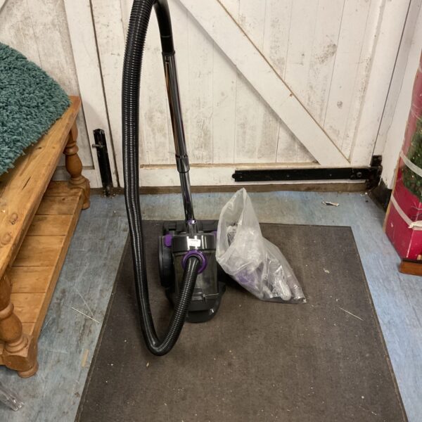 Vintage Bergstorm vacuum cleaner with flexible hose.