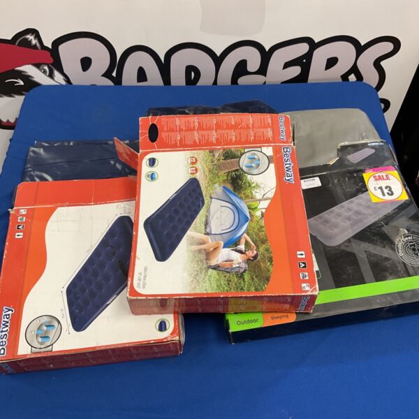 Three Bestway single airbeds in original boxes on a blue table