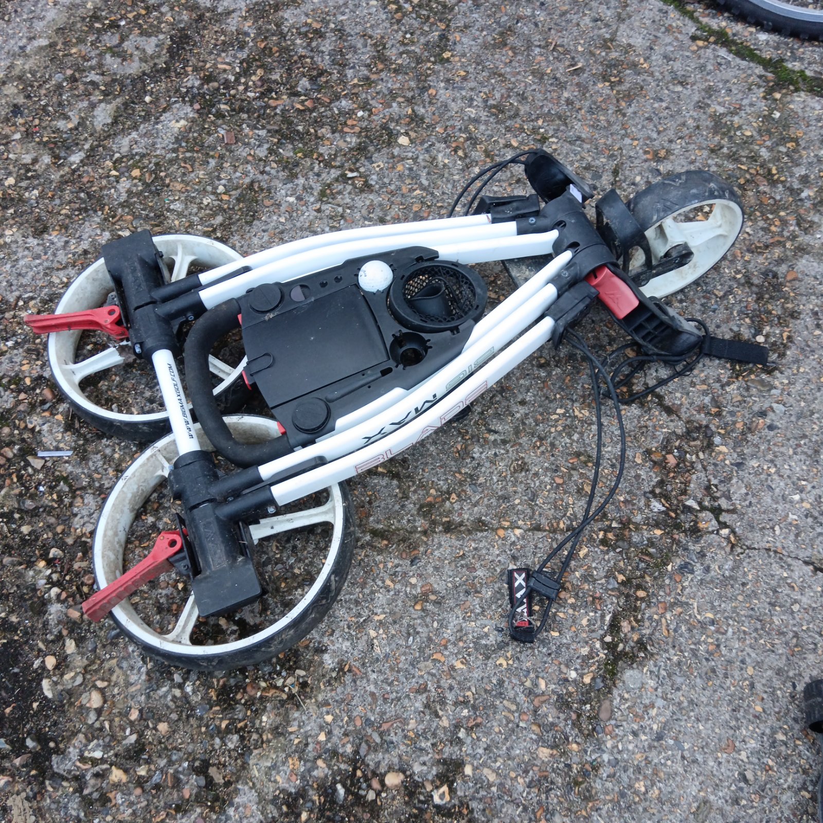 Big Mac Blade folding golf trolley with white frame and red folding levers