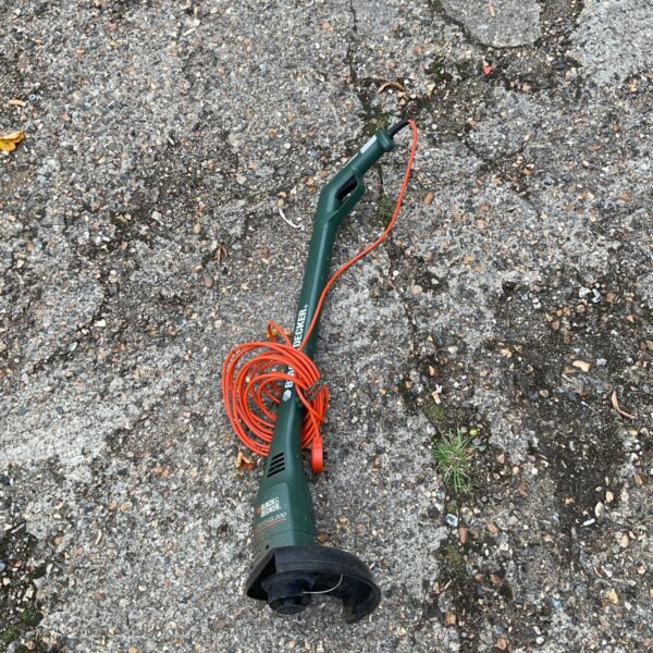 Black & Decker GL200 electric strimmer for garden maintenance.