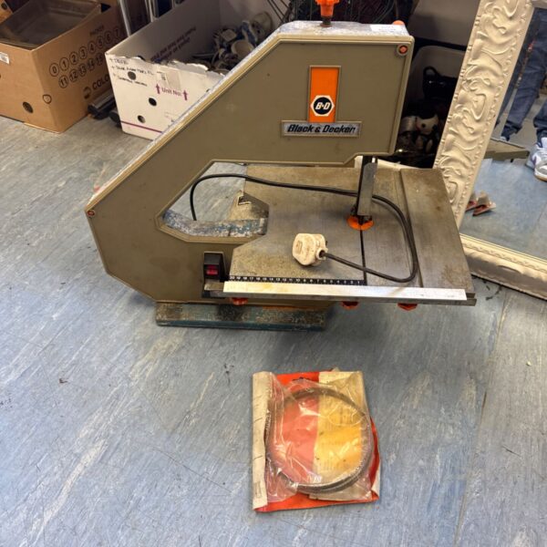 Black & Decker benchtop bandsaw with spare blade in packaging