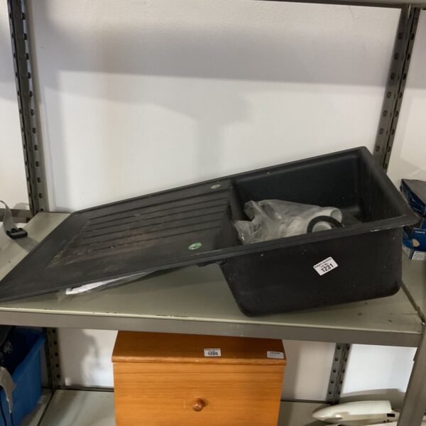 Black single bowl kitchen sink with grooved reversible drainer board