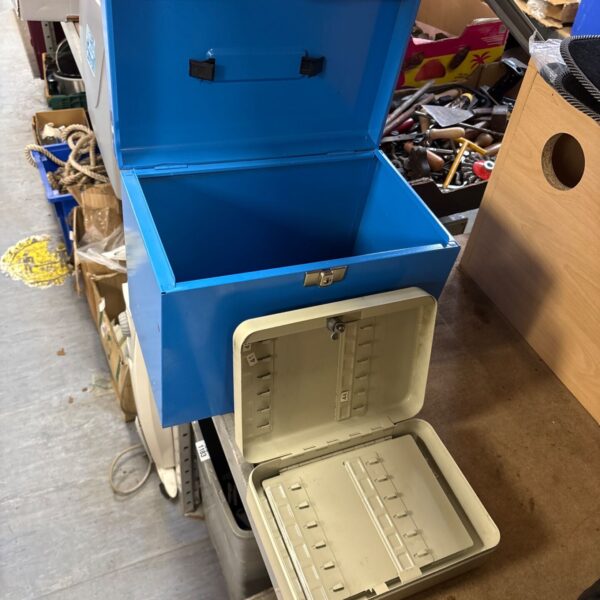 Blue metal filing storage box with open lid and cream metal keybox in front
