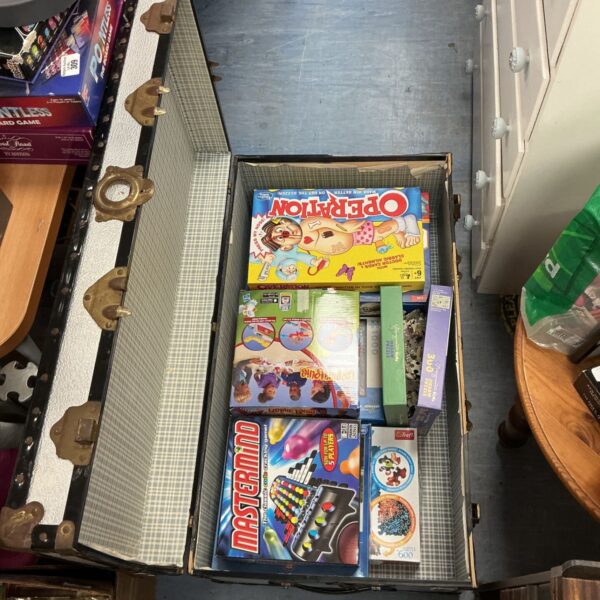 Vintage board game lot featuring Operation and Mastermind games.