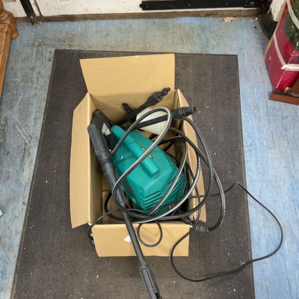 Used Bosch AHR 1000 electric pressure washer in a cardboard box.
