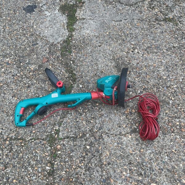 Bosch Combitrim electric grass trimmer with power cable visible.