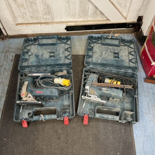 Pair of Bosch Professional corded jigsaws in carrying cases.