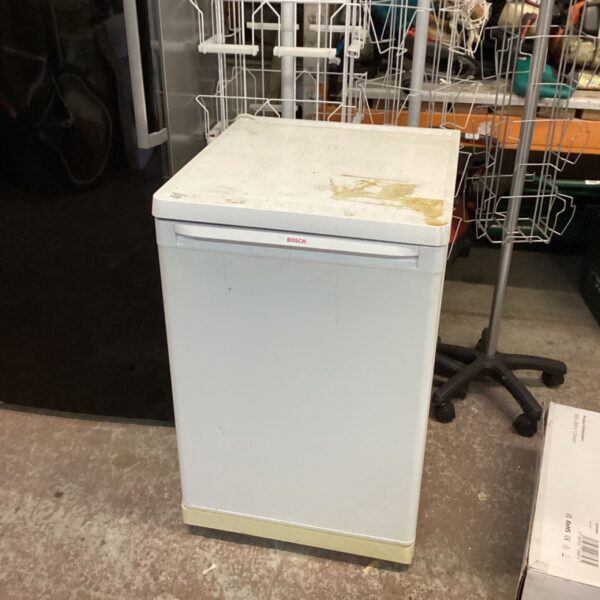 White Bosch compact fridge with flat top and cream plinth
