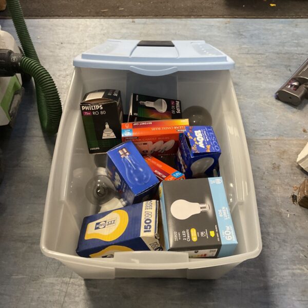Storage box containing assorted light bulbs including boxed Philips R80 reflector bulbs