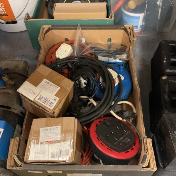 Cardboard box of electric reel extension cables and mains leads
