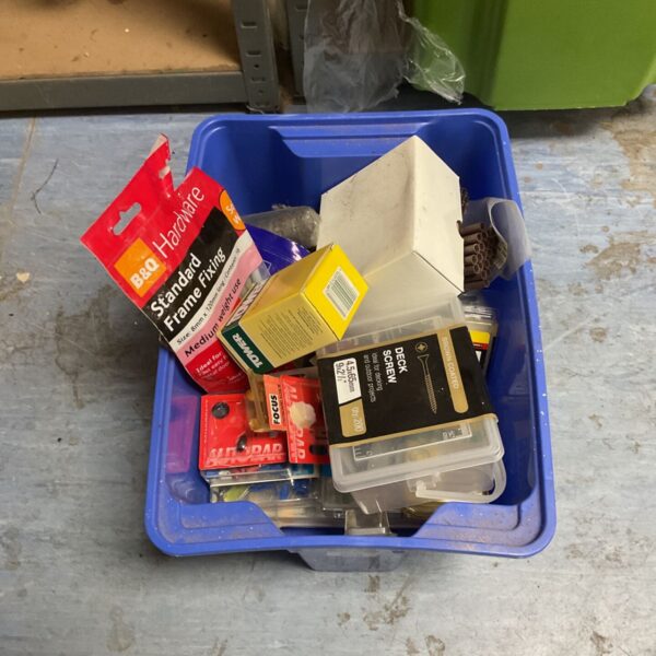 Blue crate of mixed hardware with B&Q frame fixings and deck screws