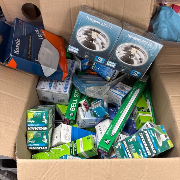 Cardboard box filled with assorted boxed halogen, reflector and LED lighting components