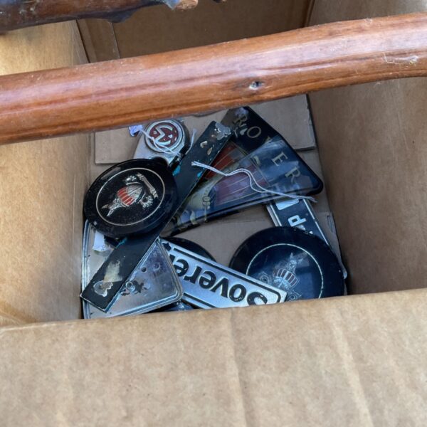 Box of assorted car badges and emblems including Rover pieces