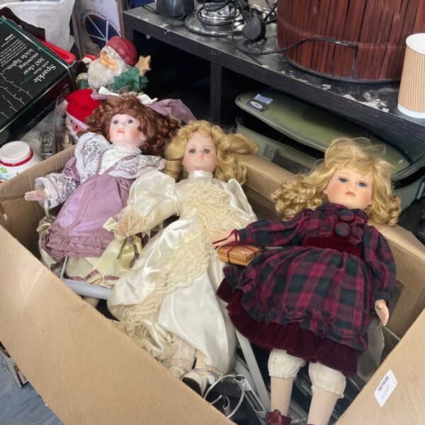 Box of three collectors dolls in lace, satin and tartan dresses