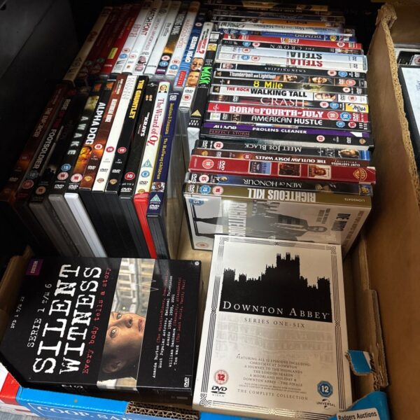 Box of mixed DVDs including Downton Abbey and Silent Witness box sets