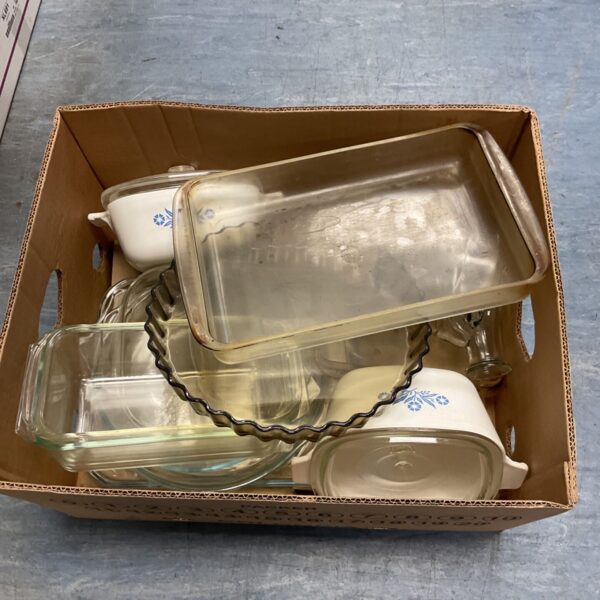 Box of Pyrex glass dishes and bowls including oblong baking dishes