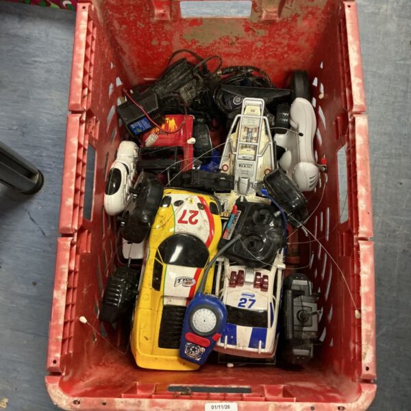 Red crate of Nikko and Tyco RC cars, controllers and chargers