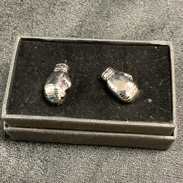Silver-toned boxing glove cufflinks, vintage sports accessory.
