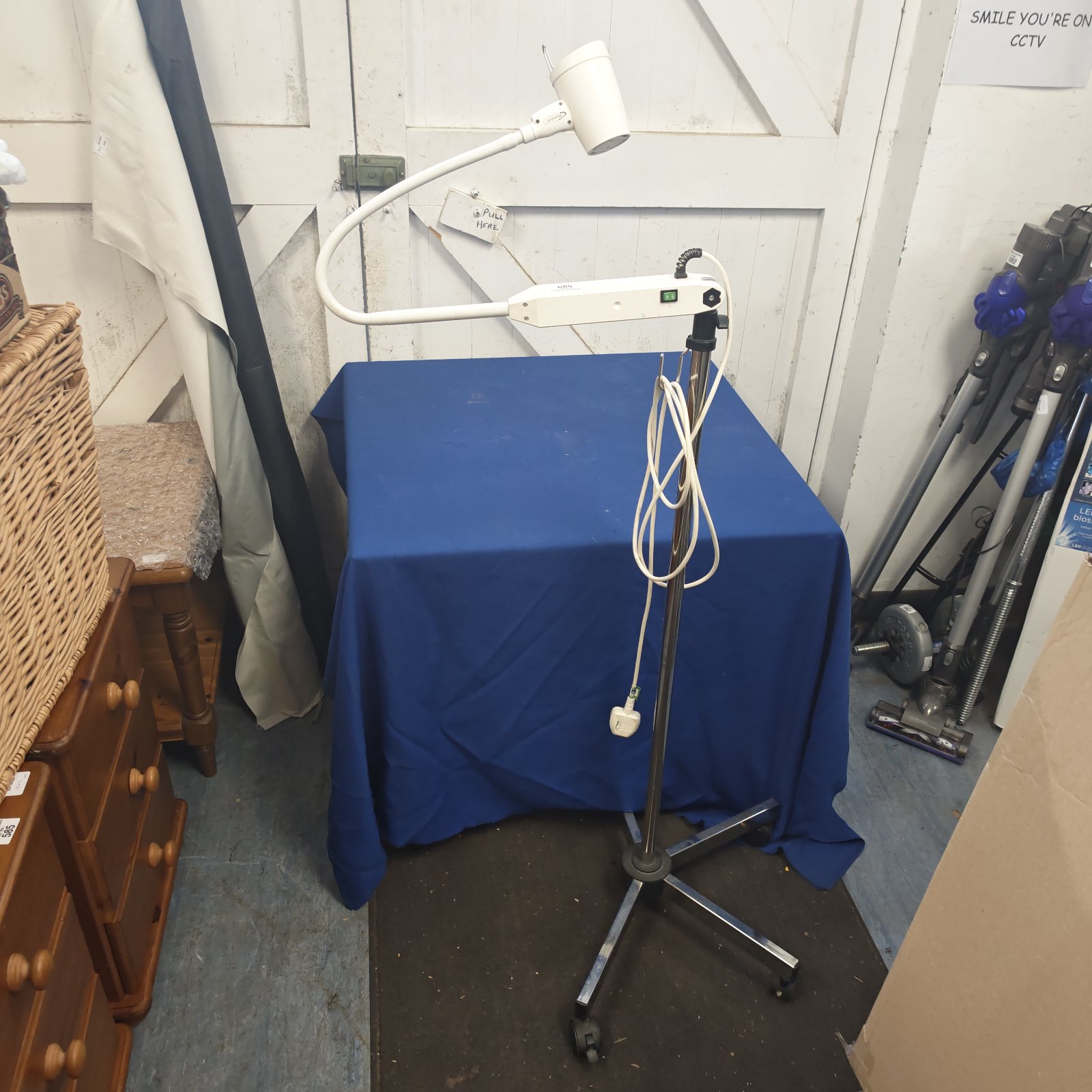 White Brandon Medical portable surgery lamp on chrome floor stand