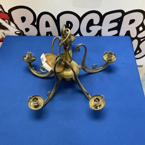 Ornate vintage brass chandelier with multiple arms.