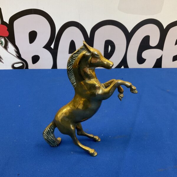 Vintage brass horse sculpture with a dynamic rearing pose.