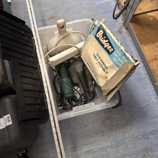 Bridges power drill in box with metal ruler and dustpan.