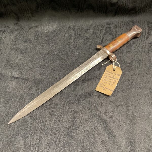 Antique British 1888 bayonet with wooden handle and steel blade.