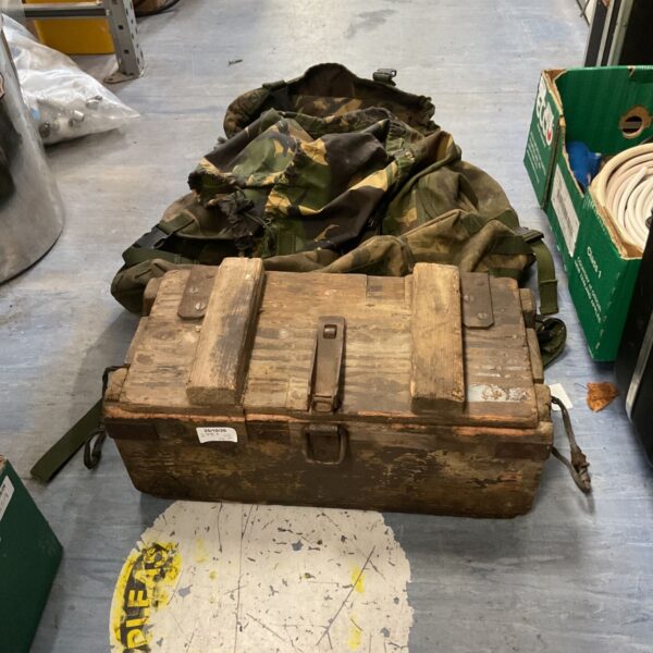 British Army woodland DPM bergen rucksack beside a vintage wooden ammunition crate