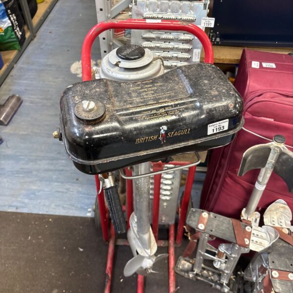 British Seagull outboard boat motor clamped onto red sack barrow