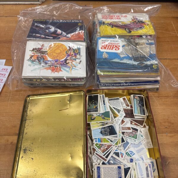 Vintage Brooke Bond tea card collection with booklets and loose cards.